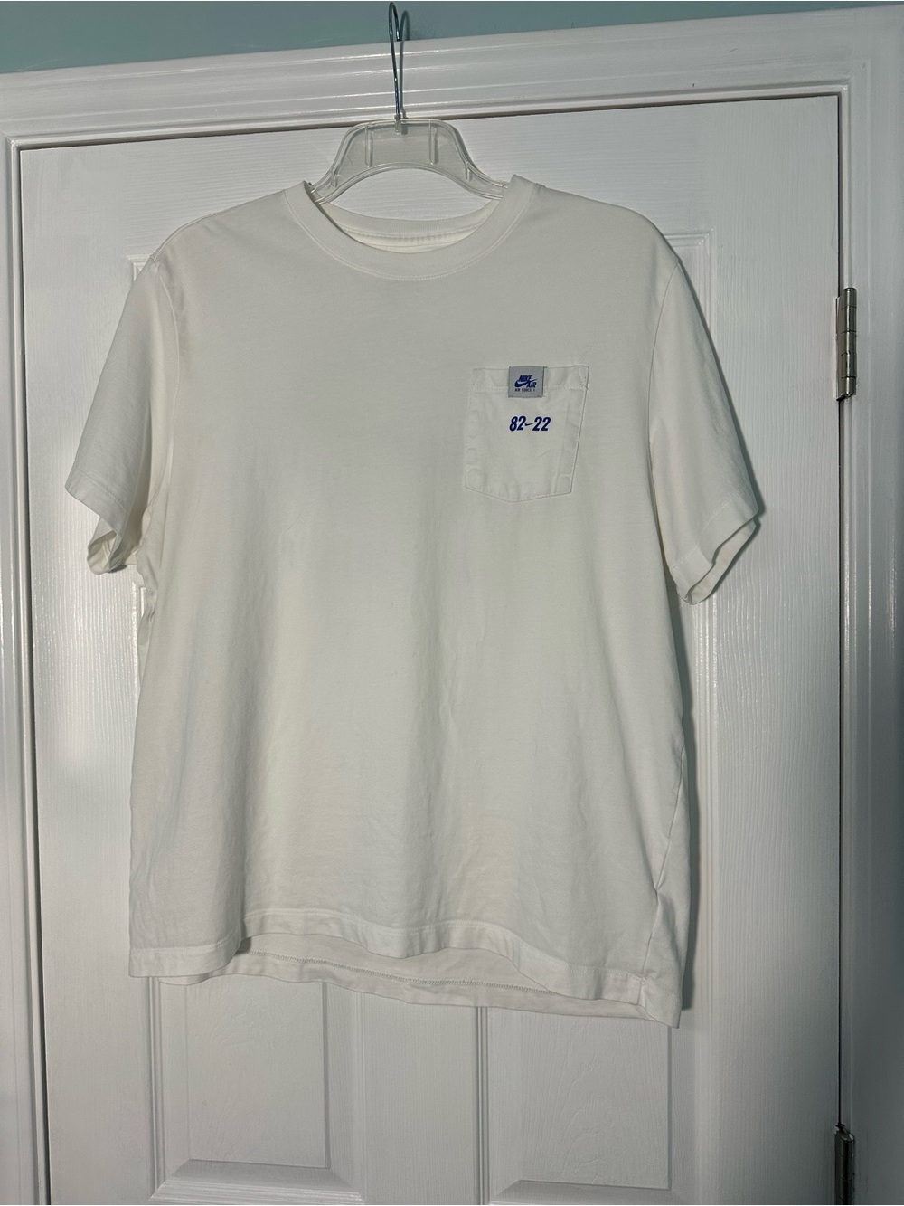 Nike White Short Sleeve Pocket Tee with Blue Logo